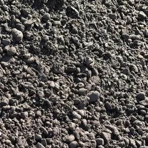 Superficie de estabilizado compactado, compuesto por grava y arena, extendido en una base para caminos y construcción.