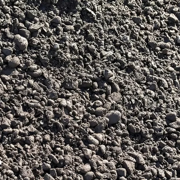 Superficie de estabilizado compactado, compuesto por grava y arena, extendido en una base para caminos y construcción.